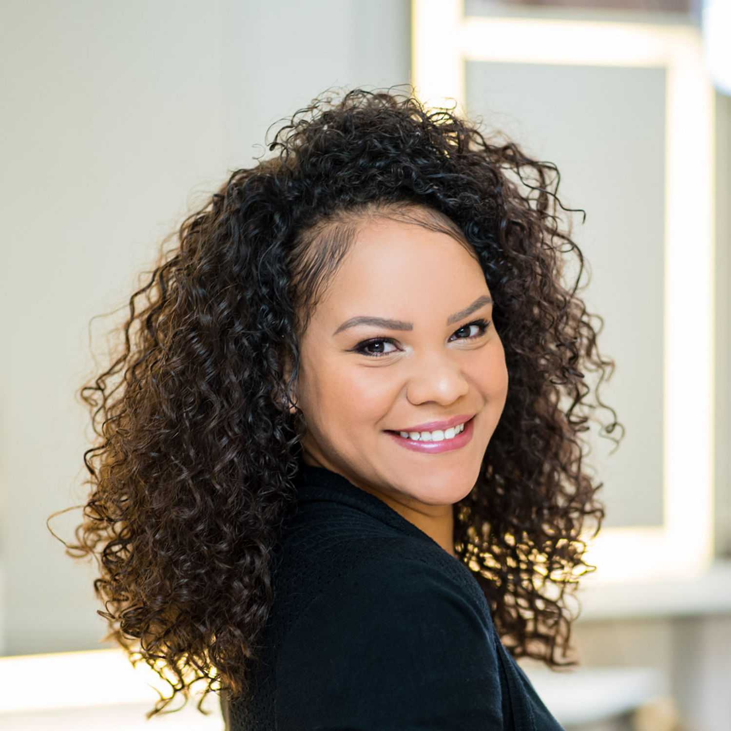 Portrait of Charity Brown, a professional stylist at Matthew Morris Salon, showcasing their expertise and style.