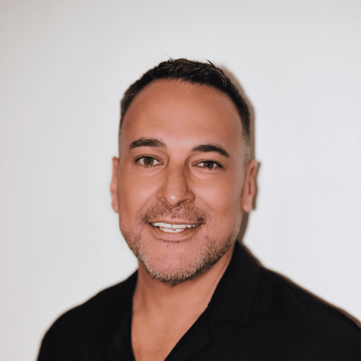 Portrait of Marvin Gutierrez, a professional stylist at Matthew Morris Salon, showcasing their expertise and style.