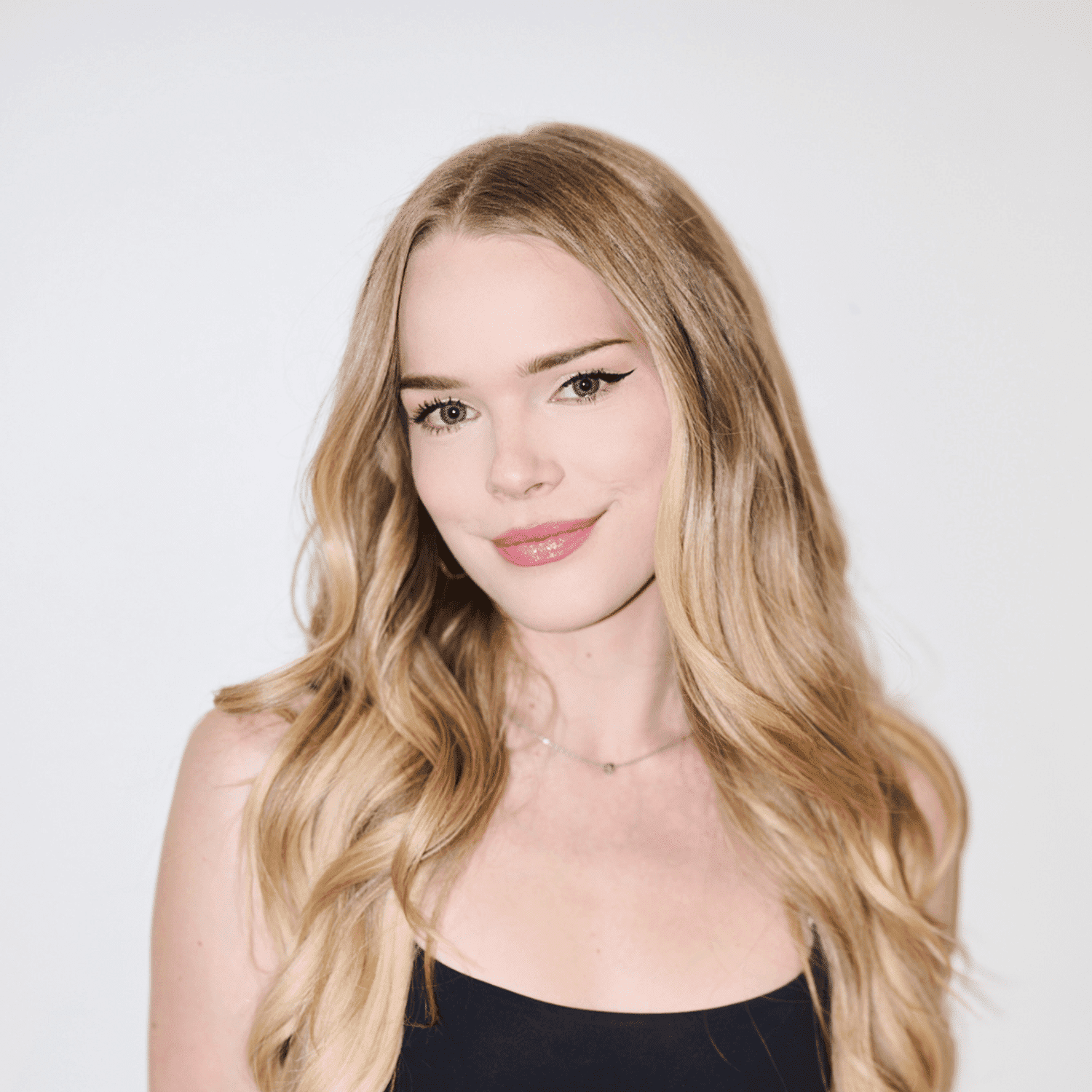 Portrait of Dylan Rhoades, a professional stylist at Matthew Morris Salon, showcasing their expertise and style.