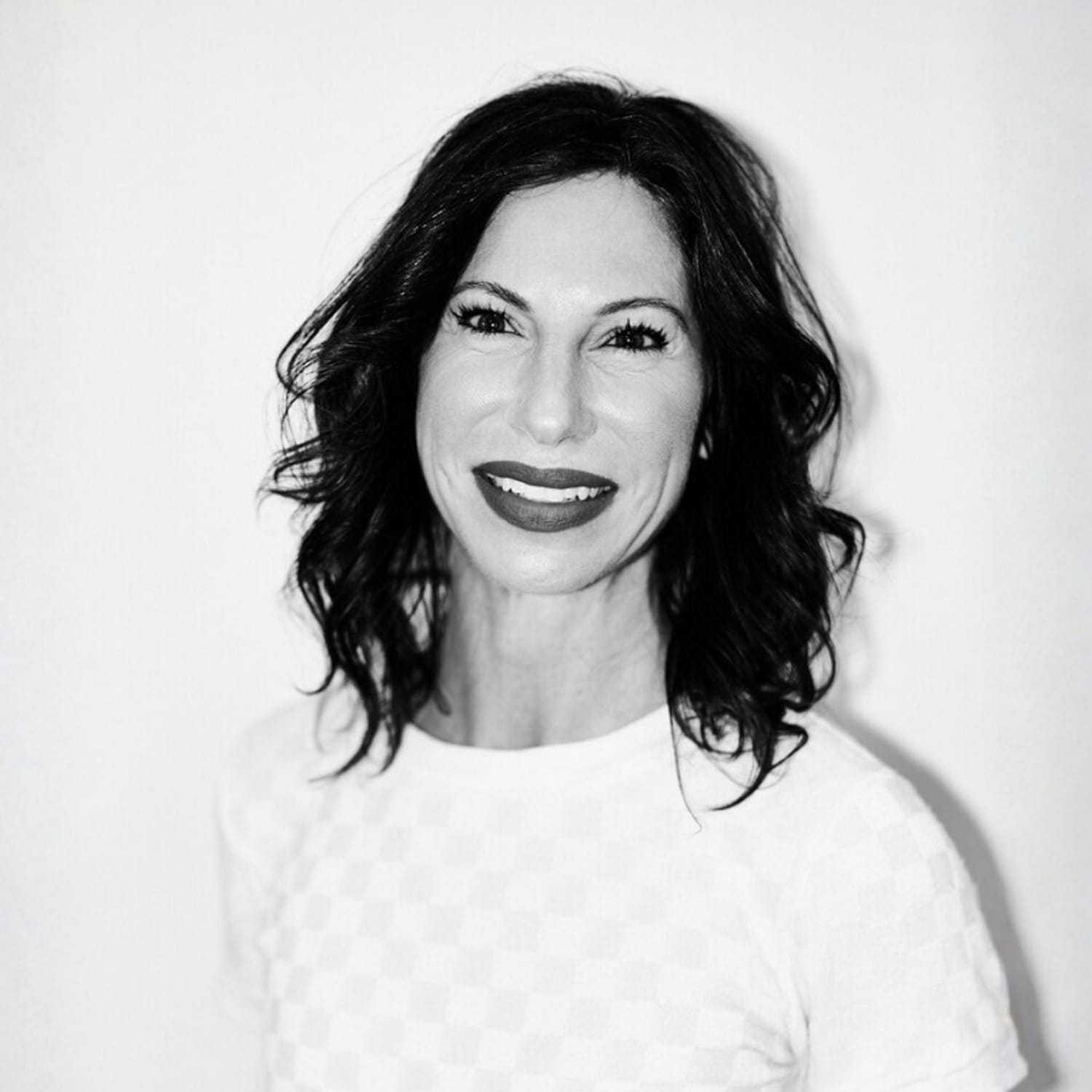 Portrait of Sharle, a professional stylist at Matthew Morris Salon, showcasing their expertise and style.