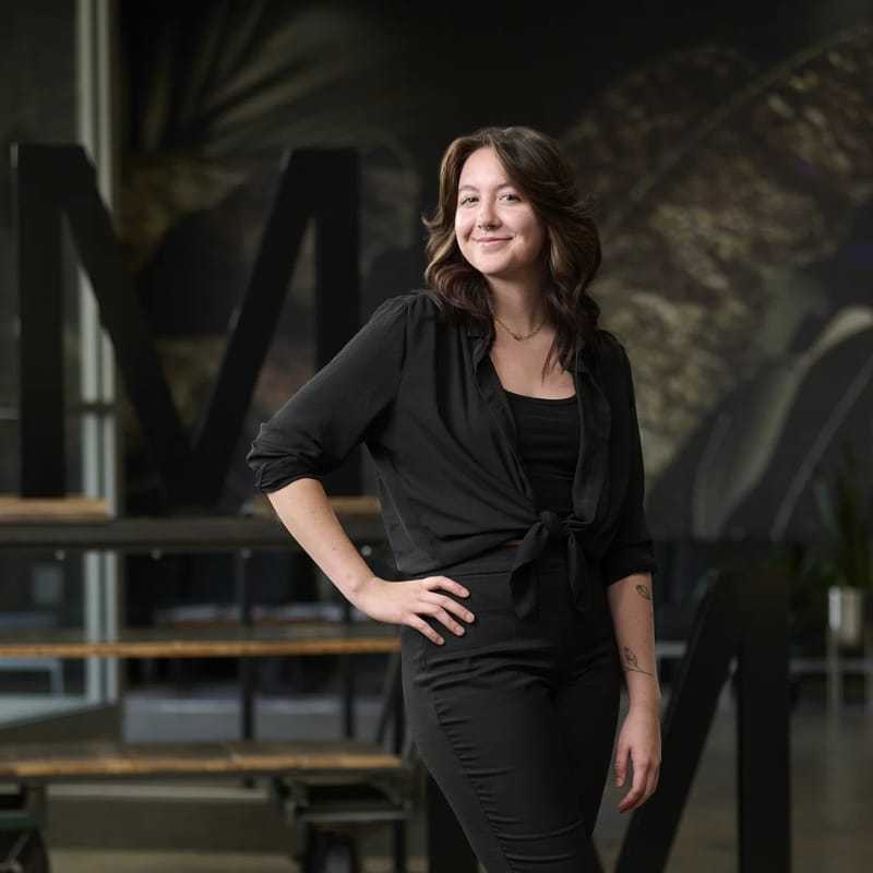 Portrait of Sydney Trevino, a professional stylist at Matthew Morris Salon, showcasing their expertise and style.