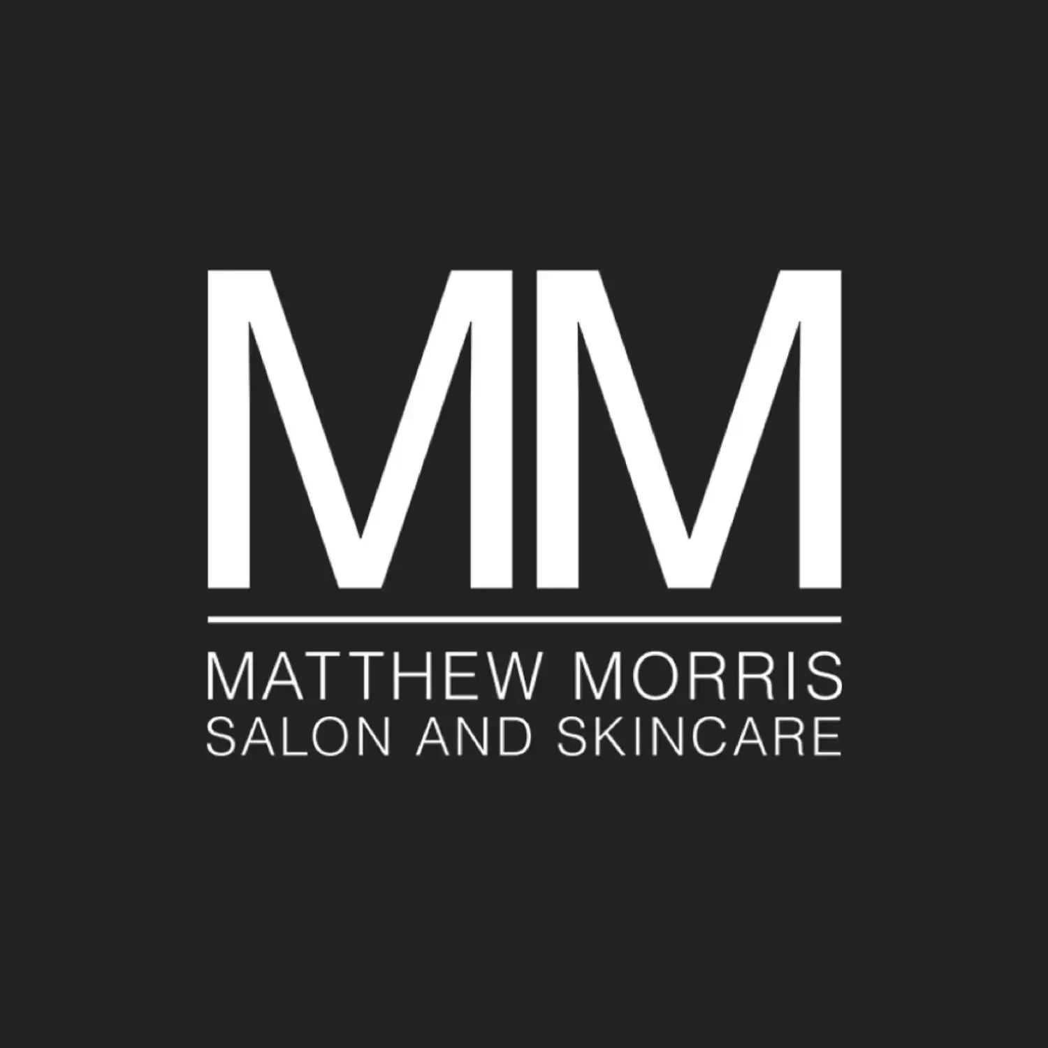 Portrait of Philip M Devin, a professional stylist at Matthew Morris Salon, showcasing their expertise and style.