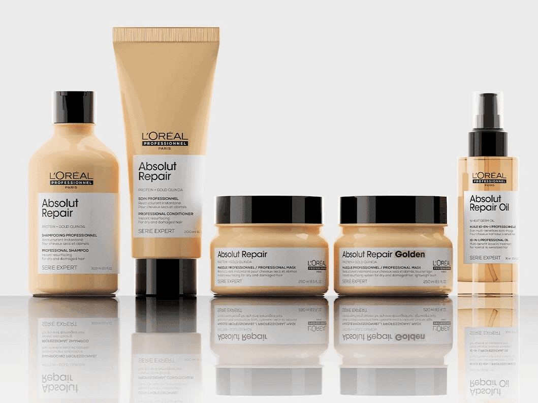 L'Oreal Absolut Repair haircare product set, including shampoo, conditioner, and oil.