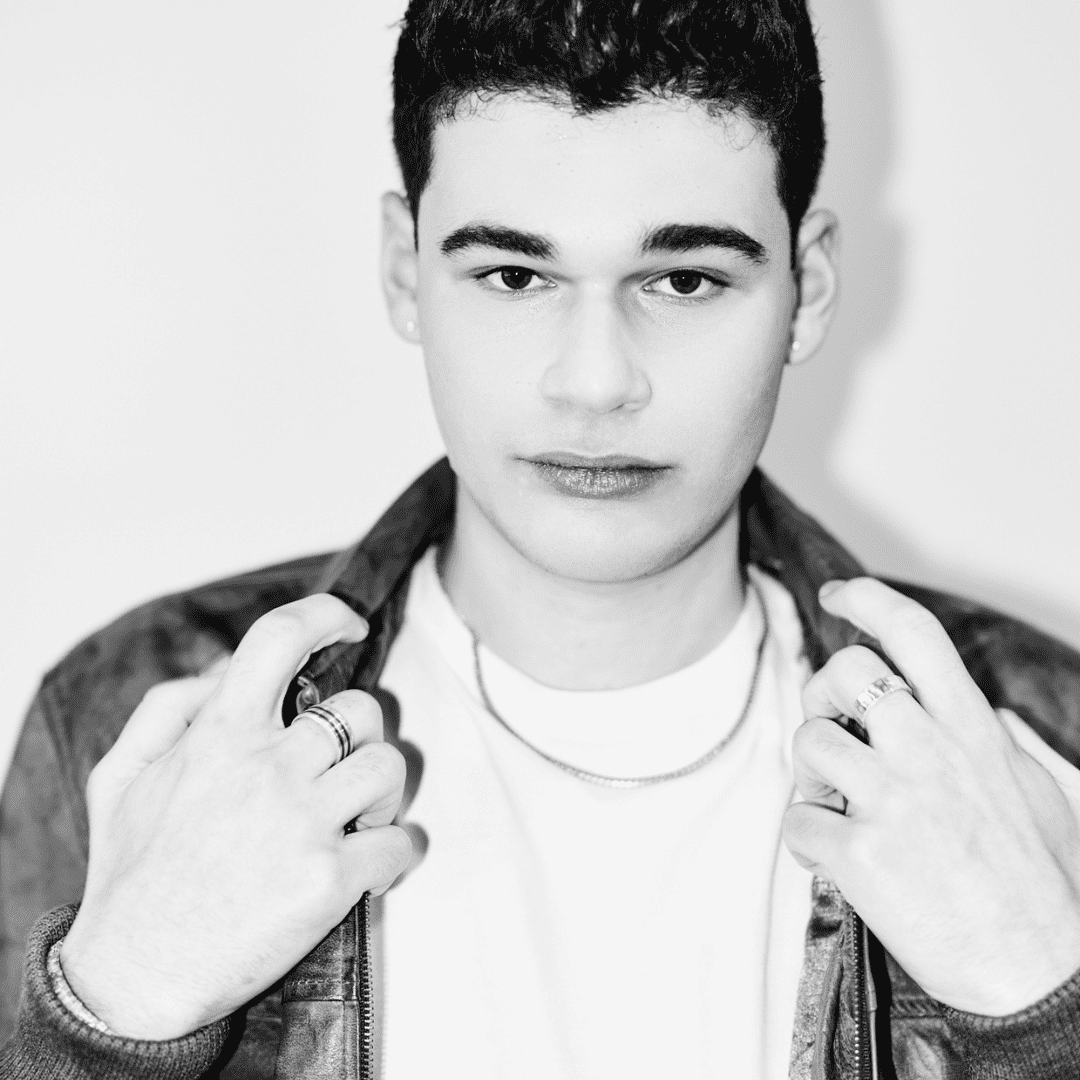 Portrait of Eli Goodman, a professional stylist at Matthew Morris Salon, showcasing their expertise and style.