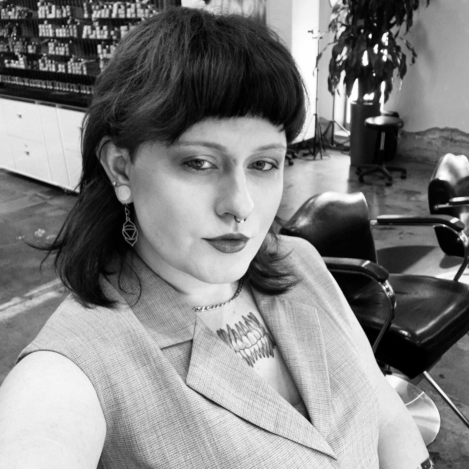 Portrait of Valentine Evangeline, a professional stylist at Matthew Morris Salon, showcasing their expertise and style.
