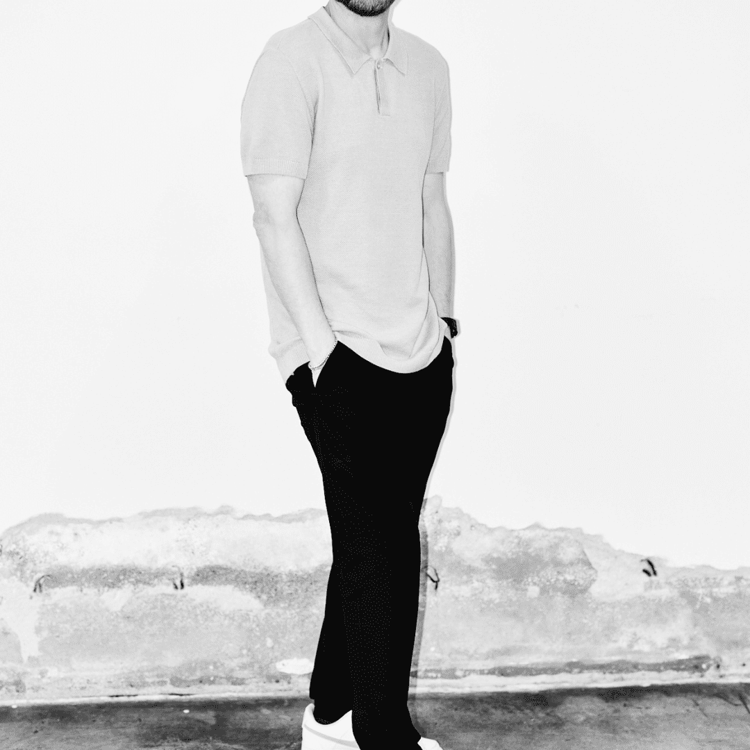 Portrait of Ainsley Wallis, a professional stylist at Matthew Morris Salon, showcasing their expertise and style.