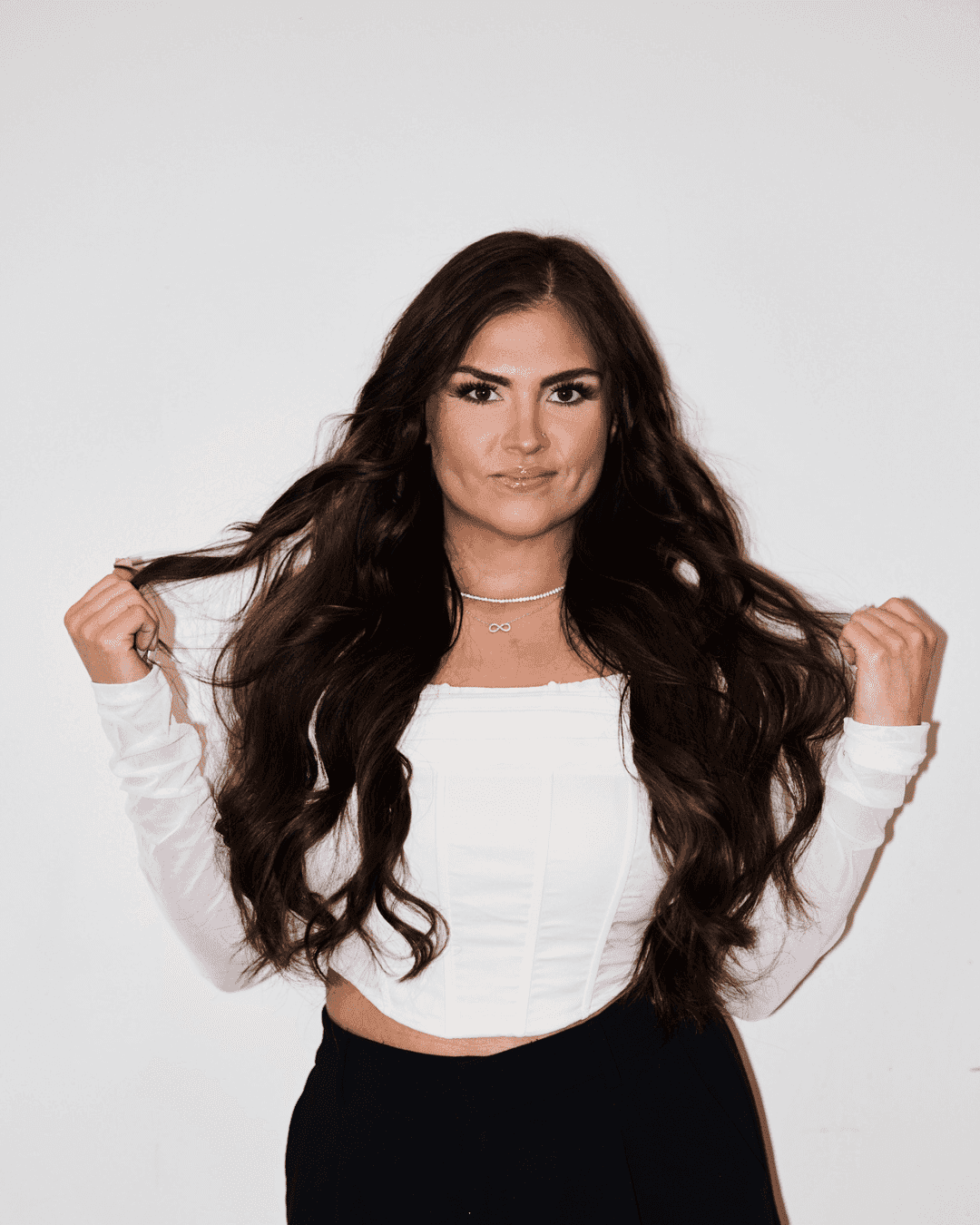 Portrait of Taylor Maes, a professional stylist at Matthew Morris Salon, showcasing their expertise and style.