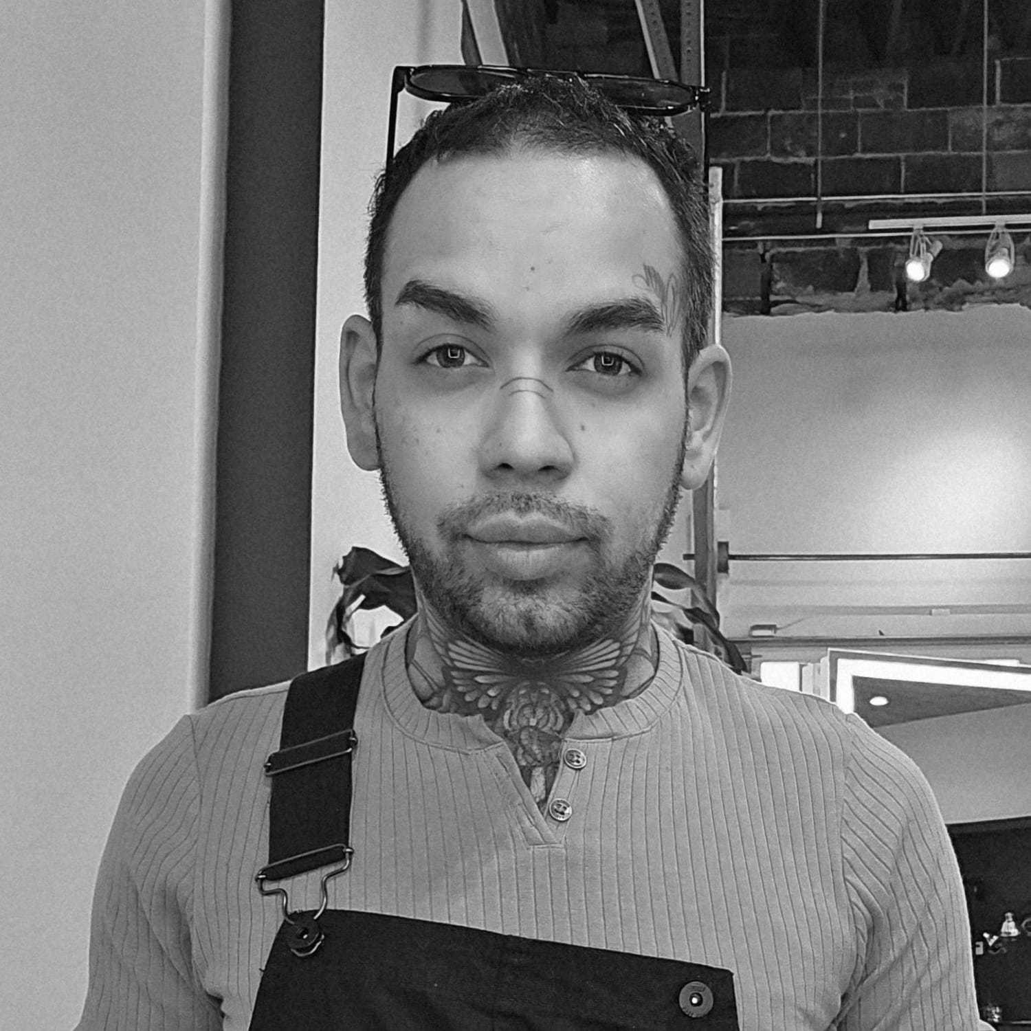 Portrait of Alex Cruz, a professional stylist at Matthew Morris Salon, showcasing their expertise and style.