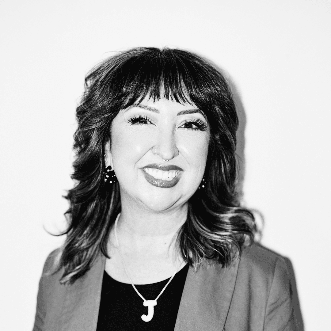 Portrait of Jenn Martínez Foster, a professional stylist at Matthew Morris Salon, showcasing their expertise and style.