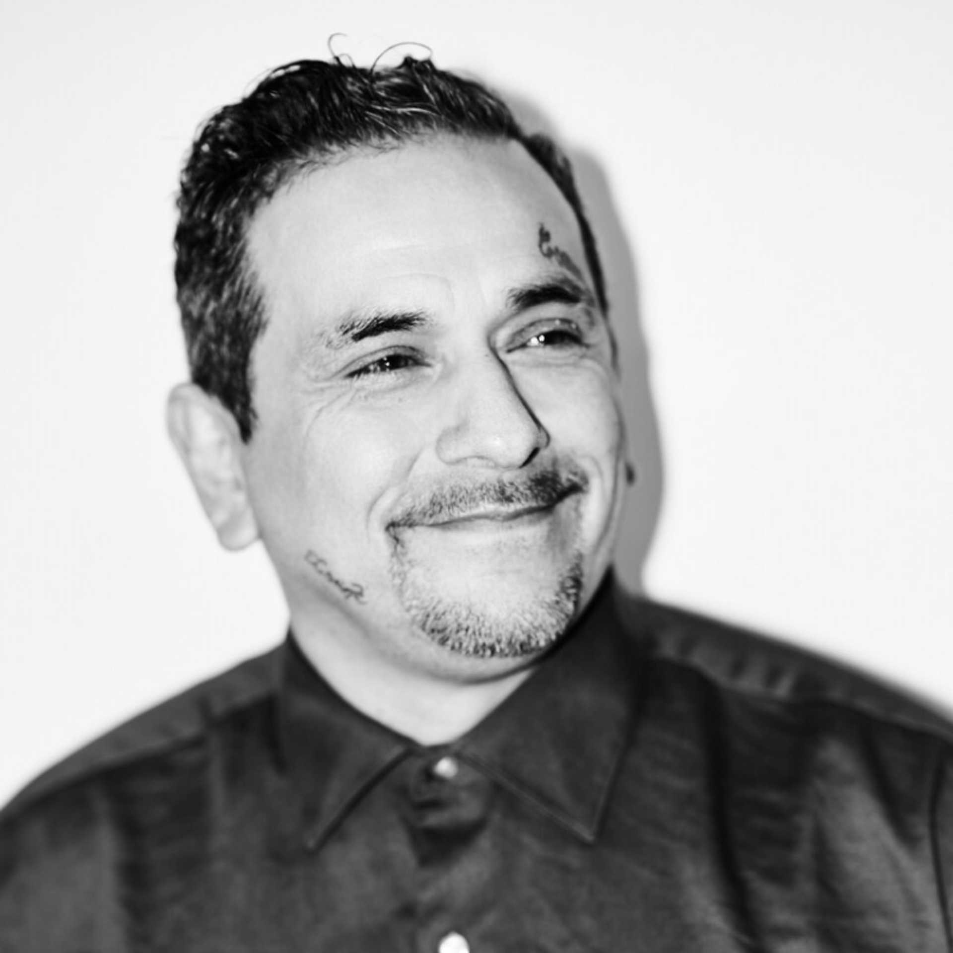 Portrait of Samuel Valle, a professional stylist at Matthew Morris Salon, showcasing their expertise and style.