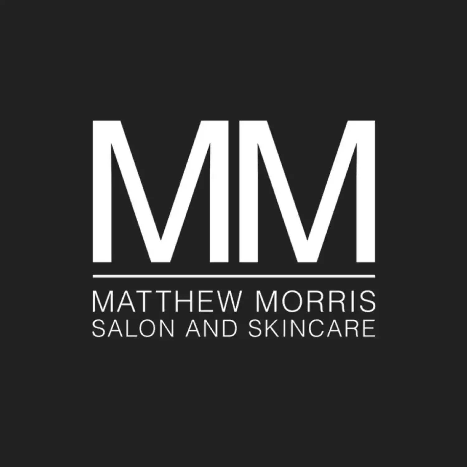 Portrait of León Valencia, a professional stylist at Matthew Morris Salon, showcasing their expertise and style.