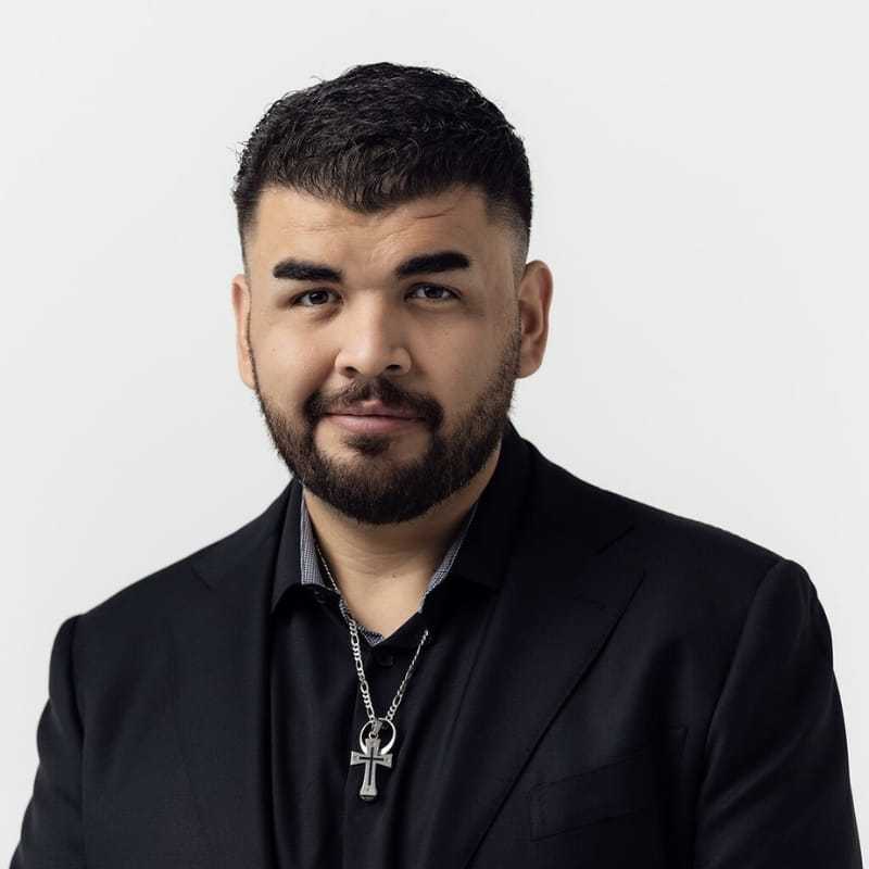 Portrait of Christian Nox, a professional stylist at Matthew Morris Salon, showcasing their expertise and style.