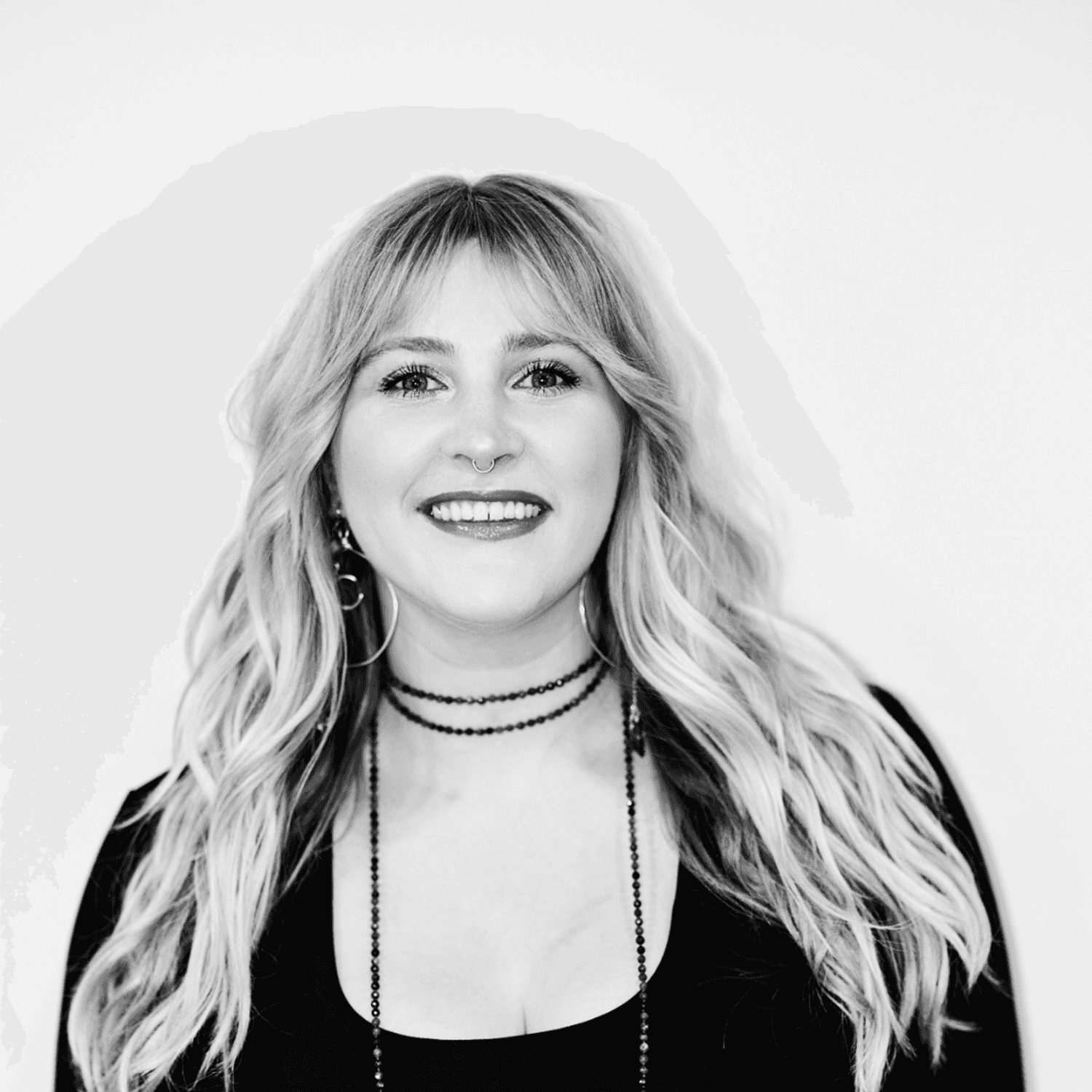 Portrait of Micah Hodges, a professional stylist at Matthew Morris Salon, showcasing their expertise and style.