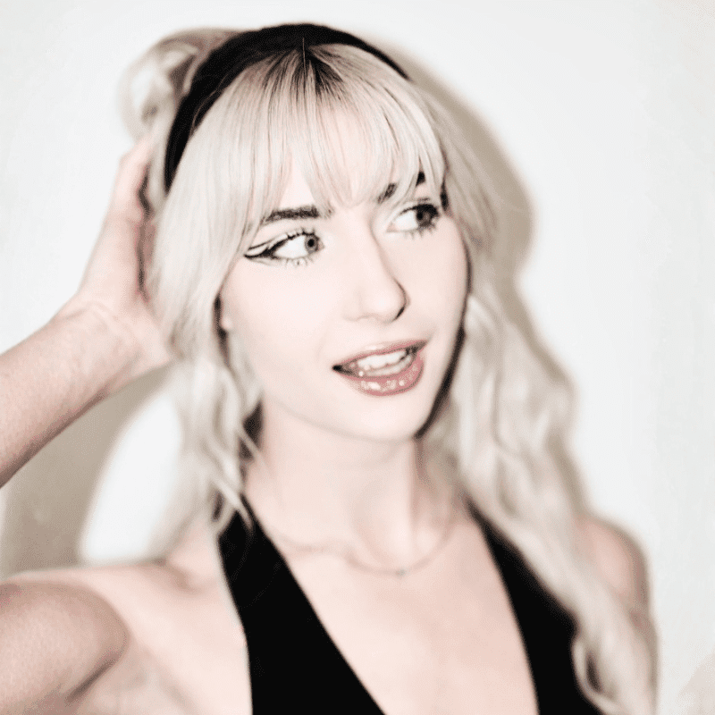 Portrait of Ella Roman, a professional stylist at Matthew Morris Salon, showcasing their expertise and style.