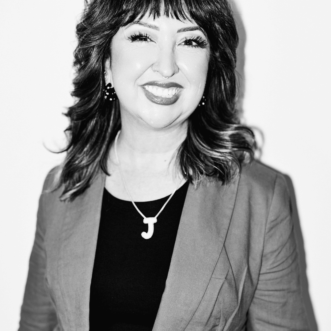 Portrait of Jenn Martínez Foster, a professional stylist at Matthew Morris Salon, showcasing their expertise and style.
